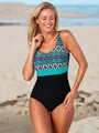 Detail of plus size one-piece swimsuit with ethnic patterns and black bottom on a beach. - M / Top And Bottom / Purple Leopard