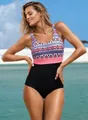 Elegant one-piece swimsuit with geometric print and black bottom for curvy women. - Light Red