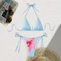 Close-up of a light blue two-piece split bikini set with elegant pink floral print - S / Top And Bottom / Red Floral on Sky Blue