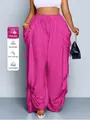 Dettaglio di pantaloni a lanterna fucsia taglie forti in viscosa fresca e traspirante - Rosso rosa