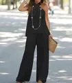 Detailed view of fashionable black halter sleeveless top and wide-leg trousers set - S / Top And Bottom / Black