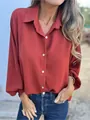 Detailed view of burnt orange long-sleeve button-down shirt with elegant lapel collar - Orange Red