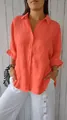 Detail shot of vibrant coral linen button-down shirt with elegant lapel and texture. - S / Tops / Orange Red