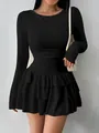 Elegant black long-sleeved slim-fit mini dress featuring a stylish tiered ruffled skirt - XS / Tops / Black