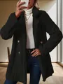 Close-up detail showing the textured black plush fabric and gold buttons of this elegant coat. - S / Tops / Black