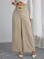 High-waist wide-leg pants for women featuring an elastic waist and decorative gold chain. - S / Bottoms / Khaki