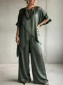 Close-up of olive green satin set featuring an asymmetrical hem and wide-leg pants - S / Top And Bottom / Green
