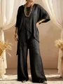 Detailed view of the black cotton linen set featuring an irregular hem and wide-leg pants - Black