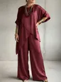 Full view of burgundy satin two-piece set with asymmetrical hem and wide pants - S / Top And Bottom / Red