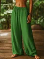 Detailed texture view of green cotton linen wide-leg pants with comfortable elastic waist - S / Bottoms / Green