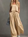 Full view of women's beige linen two-piece set with tank top and wide-leg trousers - S / Top And Bottom / Apricot