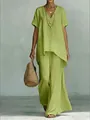 Detail of lime green V-neck tunic top and wide leg pants set with linen texture. - Yellow-Green