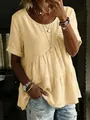 Detailed view of women's yellow tiered cotton linen t-shirt with ruffled hem and round neck - S / Tops / Yellow