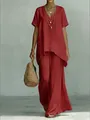 Ensemble élégant avec haut rouge à col en V et pantalon large fluide avec sac paille - S / Haut Et Bas / Rouge