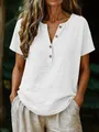 Close-up detail of a casual white cotton linen V-neck shirt with natural wooden buttons - S / Tops / White