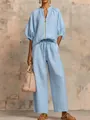 Casual lichtblauw tweedelig setje met rits-top en broek met wijde pijpen - XS / Boven- En Onderstuk / Hemelsblauw