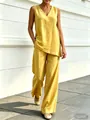Stylish yellow cotton linen two-piece outfit featuring V-neck sleeveless top and wide-leg pants - Yellow