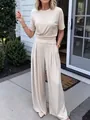 Elegant beige two-piece set with short-sleeve top and flowy wide-leg pants lifestyle shot - S / Top And Bottom / Apricot