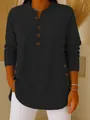 Close-up detail of women's black long sleeve Henley knit shirt with button accents - S / Tops / Black