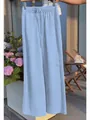 Light blue wide-leg trousers with drawstring waist, ideal for leisure or resort wear - S / Bottoms / Light Blue