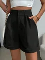 Macro detail showing texture of women's high-waisted black pleated shorts with pockets - M / Bottoms / Black