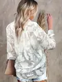 Back detail of white sheer mesh shirt with intricate floral burnout jacquard pattern - S / Tops / White