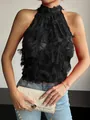 Detail of black fringed halter top with textured mesh for a romantic bohemian style look. - S / Tops / Black