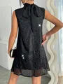 Back detail of a sparkling black sequined dress with a large bow knot at the neckline. - S / Dresses / Black