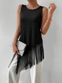 Detail view of black rib knit sleeveless top featuring a stylish long fringe hem. - S / Tops / Black