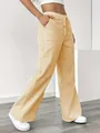 Detail shot of yellow and white vertical striped casual wide-leg pants for women. - S / Bottoms / Yellow