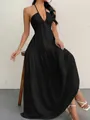 Detailed view of backless black halter maxi dress with deep V-neck and tiered skirt - S / Tops / Black