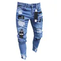 Men's light blue slim-fit ripped denim jeans featuring unique embroidered badges and patches - S / Bottoms / Blue