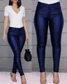 Close-up of shiny dark blue slim-fit PU leather pants for women with metallic finish - S / Bottoms / Blue