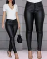 Close-up detail view of women's slim fit high-waisted black PU leather pants - S / Bottoms / Black