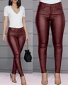 Close-up detail of wine red PU leather skinny pants with slim fit fashion design - S / Bottoms / Burgundy