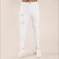 Trendy men's white distressed skinny jeans with ripped details for a modern slim look - S / Bottoms / White