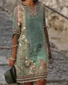Detail of a green bohemian V-neck dress with vintage floral ethnic prints for women - S / Green