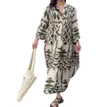 Detailed view of a bohemian geometric print maxi shirt dress with a tiered skirt design - S / Tops / Green