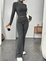 Slim fit charcoal grey ribbed knit two-piece set with crop top and flared pants. - Slate Gray