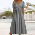 Detailed view of the grey crossover V-neck bodice and flared skirt with side pockets - S / Tops / Gray