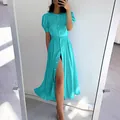 Detail shot of a cyan slim fit button-front midi dress featuring stylish puff sleeves - S / Top And Bottom / Lake Blue