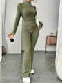 Close-up of olive green ribbed knit set with a slim-fit crop top and flare pants - S / Top And Bottom / Army Green