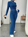 Full-body view of blue ribbed knit set with cropped mock neck top and pants. - S / Top And Bottom / Blue