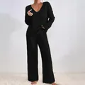 Completo da casa da donna nero a coste con top con scollo a V e pantaloni larghi - XS / Top E Pantaloni / Nero
