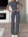 Solid grey two-piece lounge set featuring a short sleeve crop top and matching wide leg pants. - XS / Set / Dark Gray