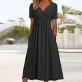 Elegant black short sleeve maxi dress with V-neck wrap design and practical pockets - S / Tops / Black