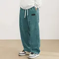 Pantaloni da uomo in velluto a coste color ottanio con coulisse bianca e logo patch - XS / Pantaloni e gonne / Blu lago