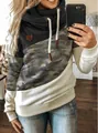 Close-up detail of women's trendy color-block cowl neck hoodie with camouflage print pattern - S / Tops / Camouflage + Black