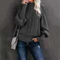 Close-up view of a grey cable knit sweater featuring elegant oversized lantern sleeves - Dark Gray