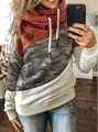 Detailed view of women's cowled neck hoodie featuring rust red and camouflage splicing - S / Tops / Camouflage and Orange